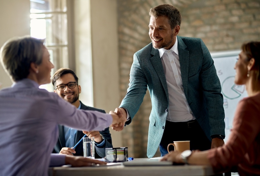 business-coworkers-shaking-hands-meeting-office-focus-is-businessman
