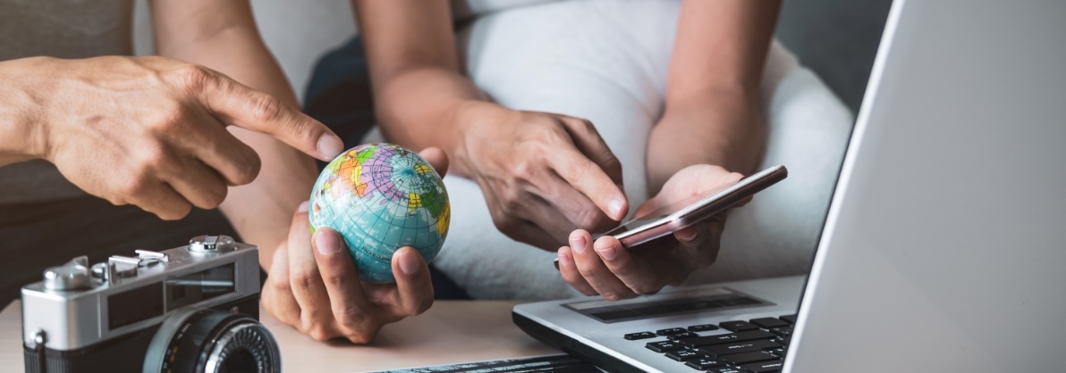 young-couple-planning-vacation-trip-and-searching-2023-11-27-05-30-19-utc