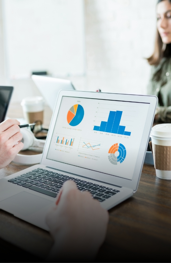 businessman-analyzing-graphs-laptop-while-working-with-colleague-office businessman-analyzing-graphs-laptop-while-working-with-colleague-office
